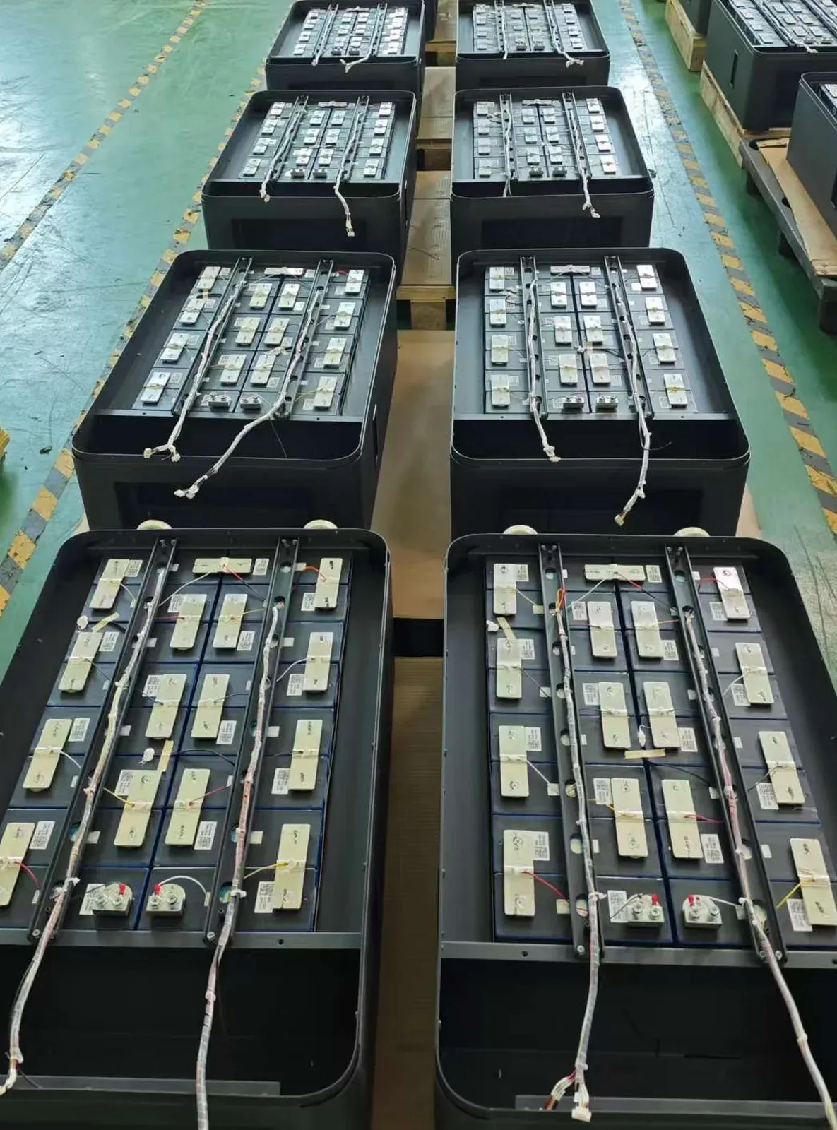 Laser-welded semi-finished ESS battery packs in rows on the assembly line