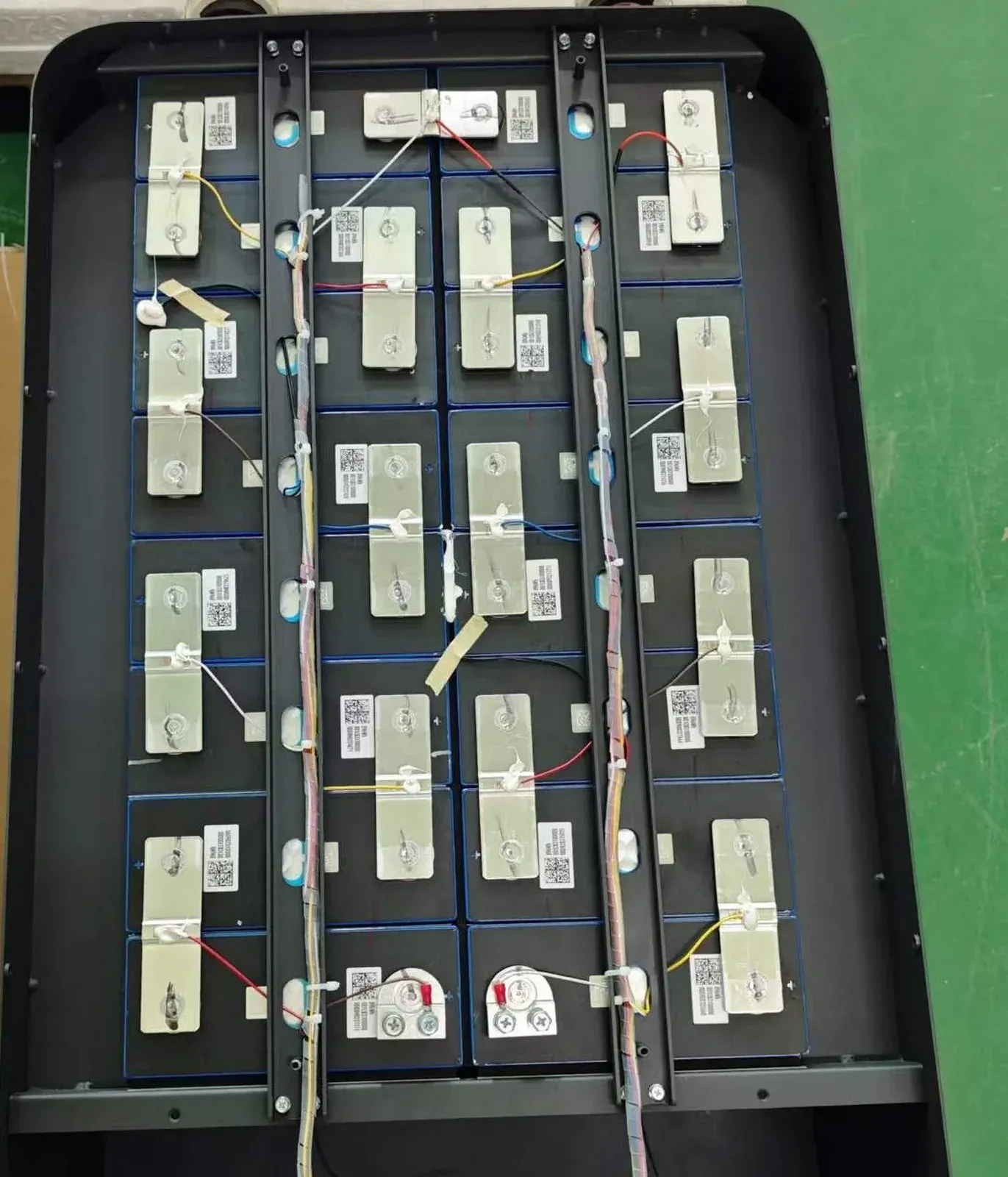 Laser-welded busbars and cell QR labels inside a semi-finished LiFePO4 battery pack