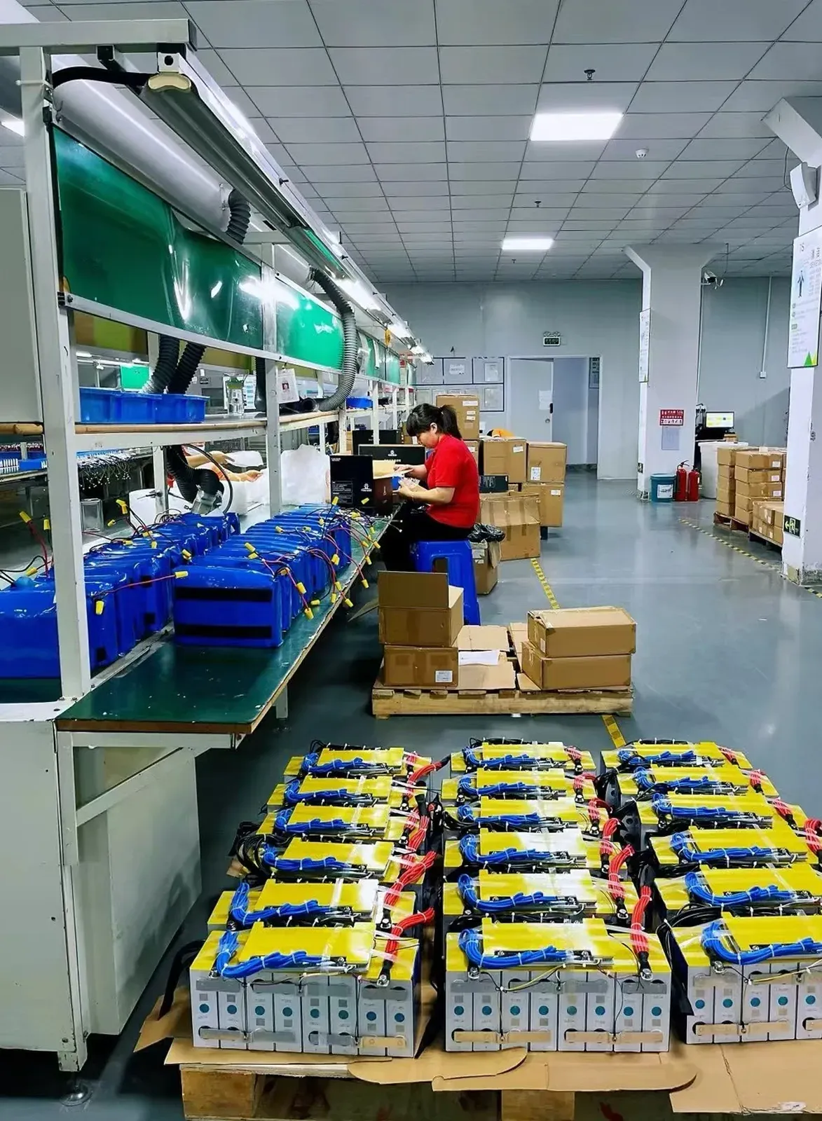 Battery pack assembly on the production line with semi-finished packs and matched cells