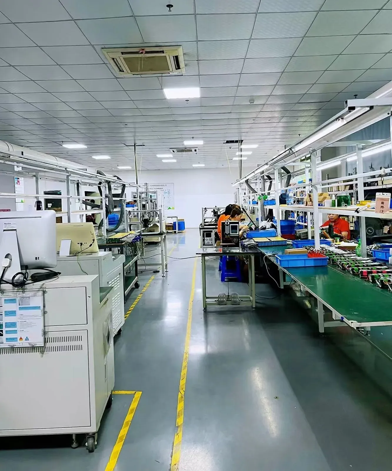 Workshop view of the battery pack assembly line with workstations and equipment